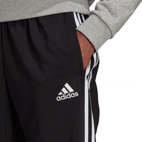 Spodnie adidas Essentials Tapered Cuff 3 Stripes M GK8980 Spodnie adidas Essentials Tapered Cuff 3 Stripes M GK8980